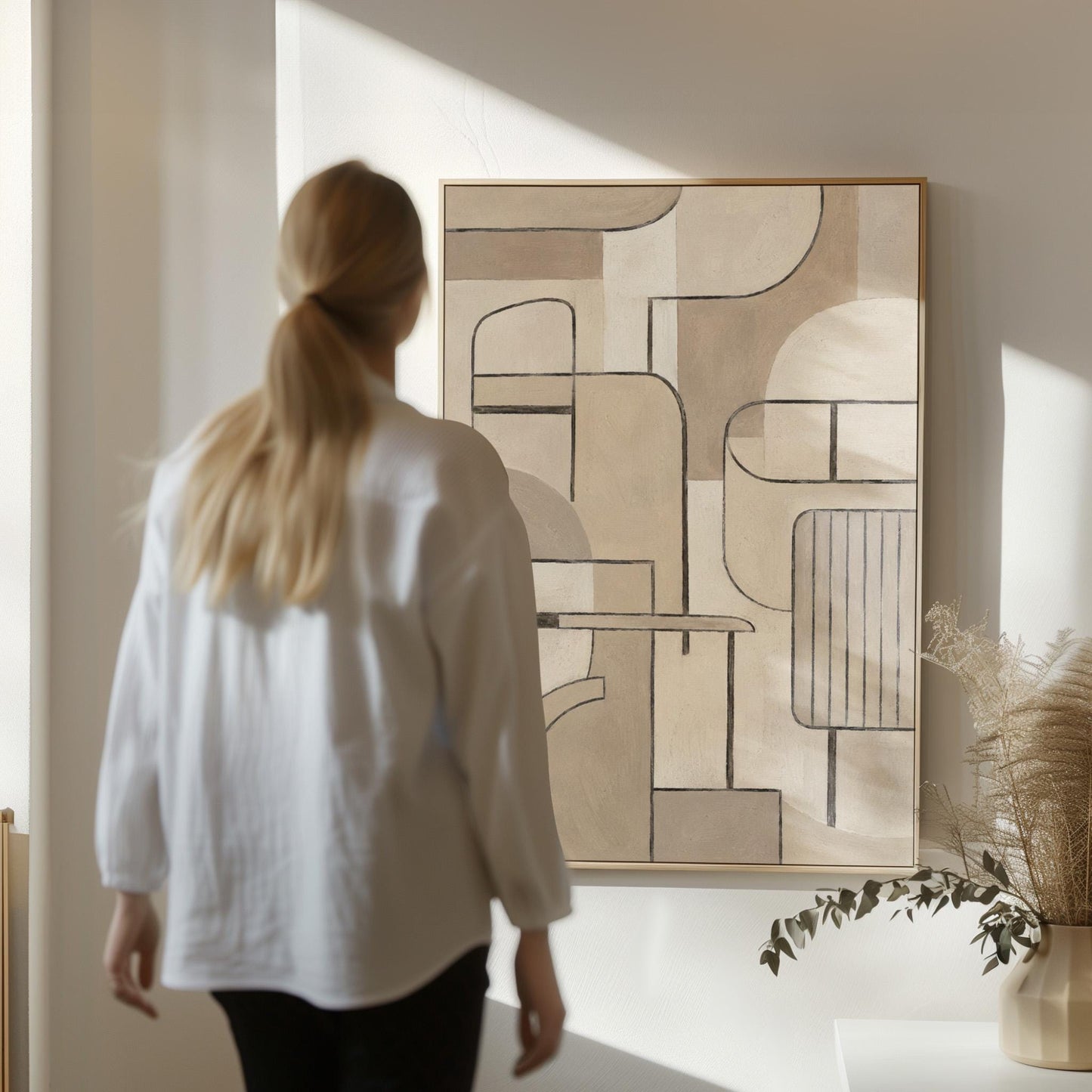 Bauhaus inspired line composition with geometric shapes in beige tones, canvas wall art on a quiet wall in a considered interior