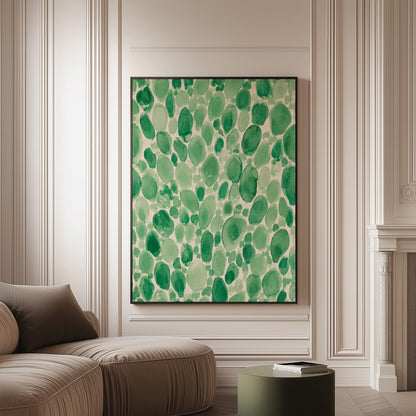 Dense watercolor pebble shapes in mint to emerald green, canvas print on a softly lit wall in a calm interior
