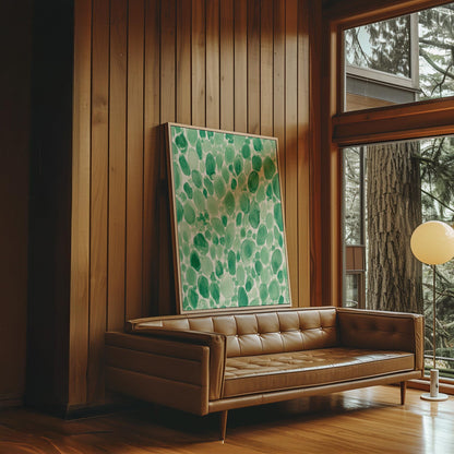 Dense watercolor pebble shapes in mint to emerald green, canvas wall art presented in a light, minimal room