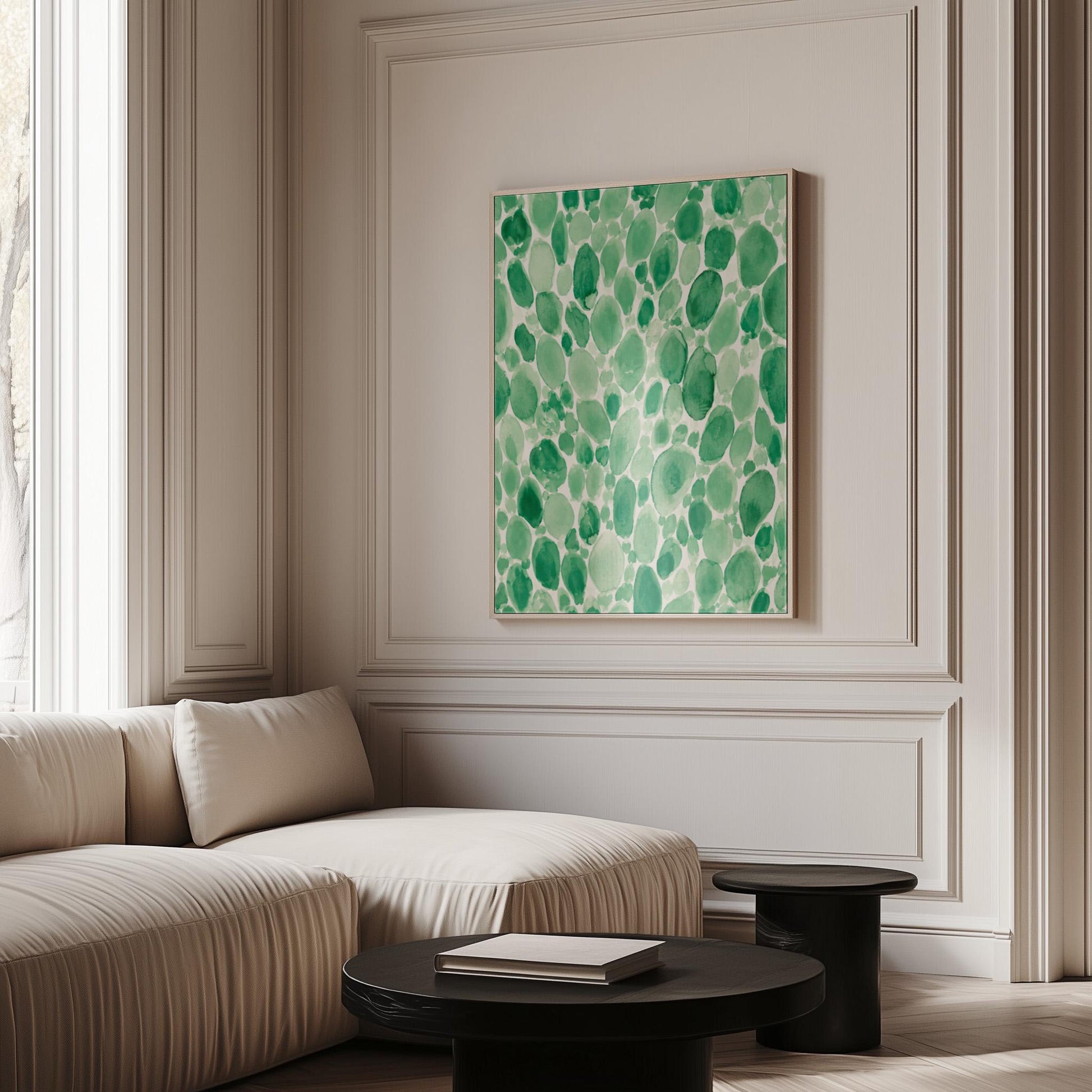 Dense watercolor pebble shapes in mint to emerald green, canvas wall art on a quiet wall in a considered interior