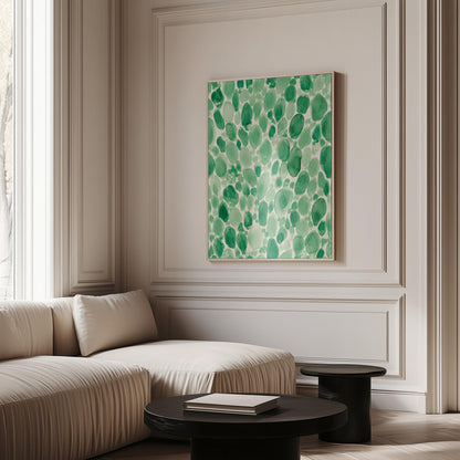 Dense watercolor pebble shapes in mint to emerald green, canvas wall art on a quiet wall in a considered interior