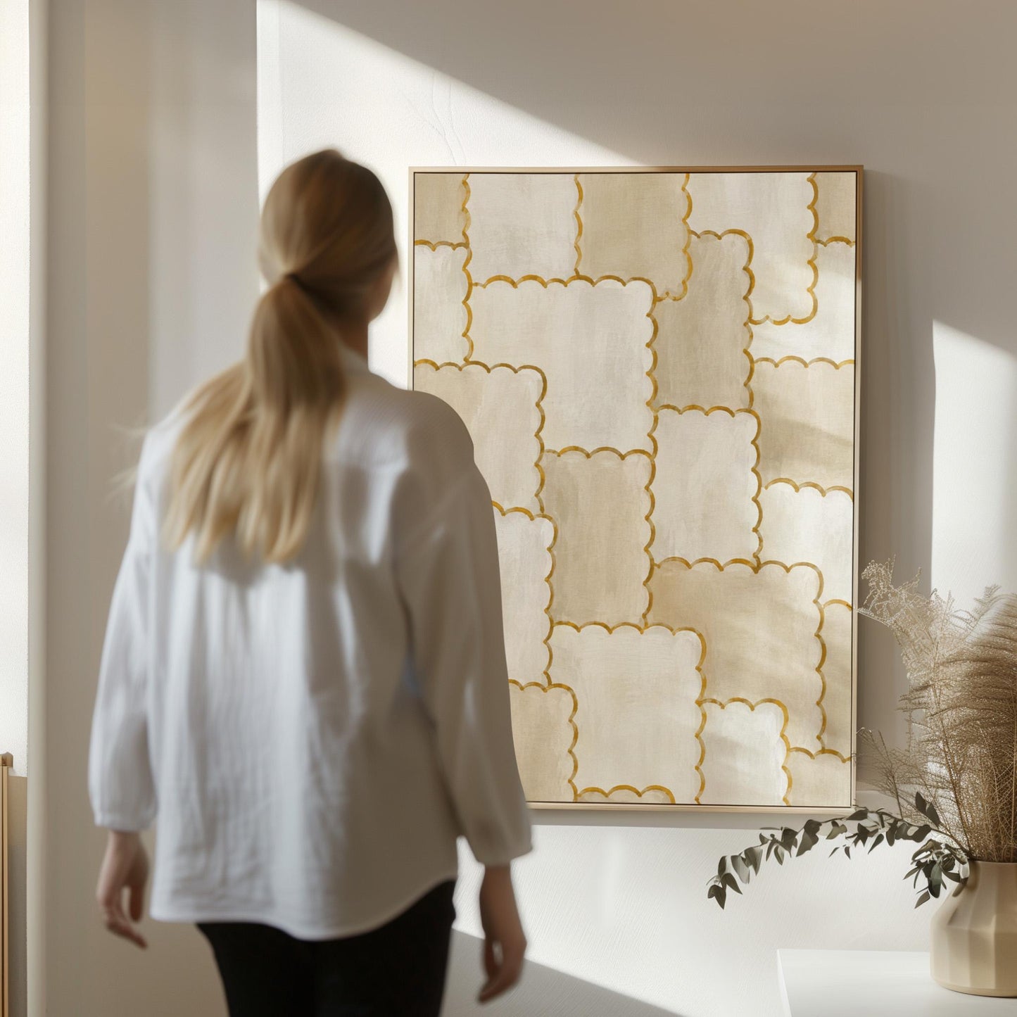 Overlapping tile pattern with scalloped gold edges in beige, canvas print shown to scale in a furnished room