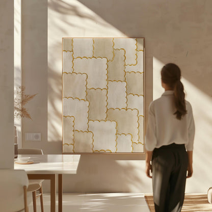 Overlapping tile pattern with scalloped gold edges in beige, canvas print displayed on a neutral wall in a styled interior