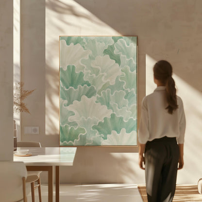 Fan shaped leafy forms in soft sage green watercolor, canvas print hanging in a calm, modern living space
