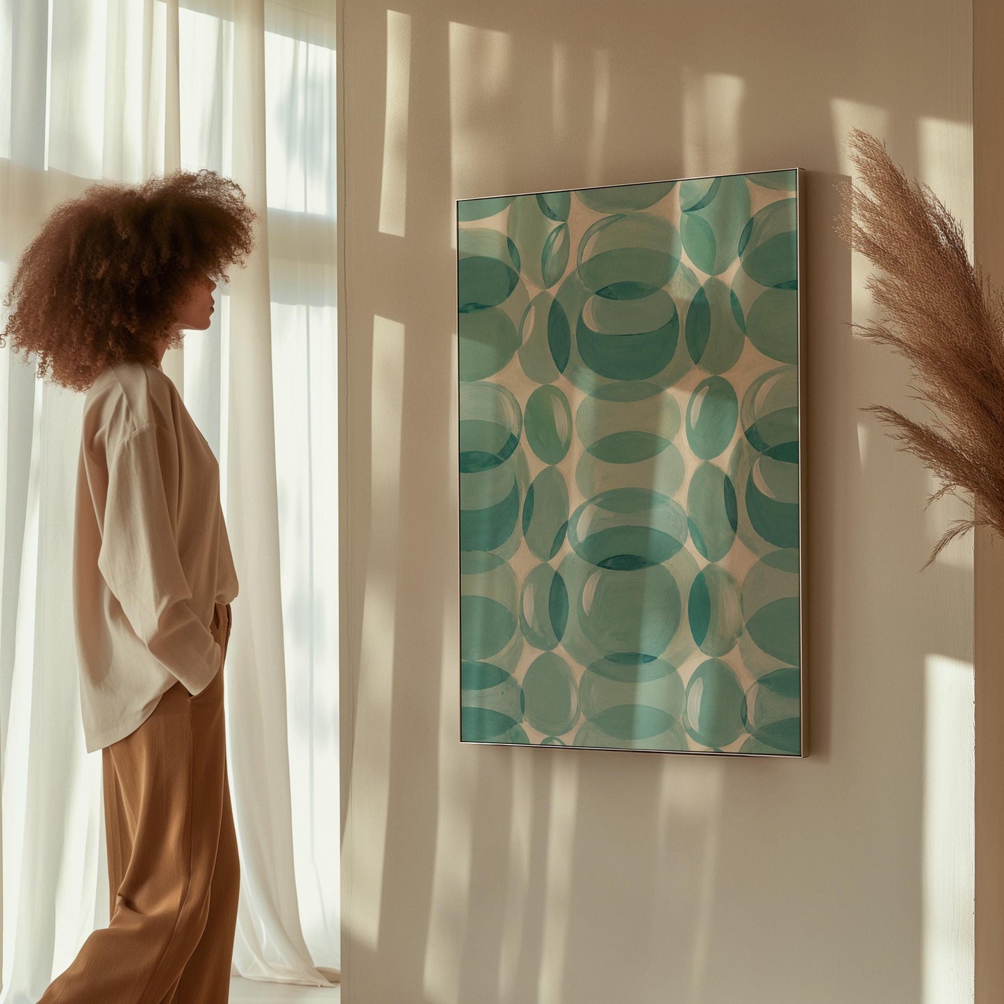 Overlapping translucent circles in teal and aqua tones, canvas print on a quiet wall in a considered interior