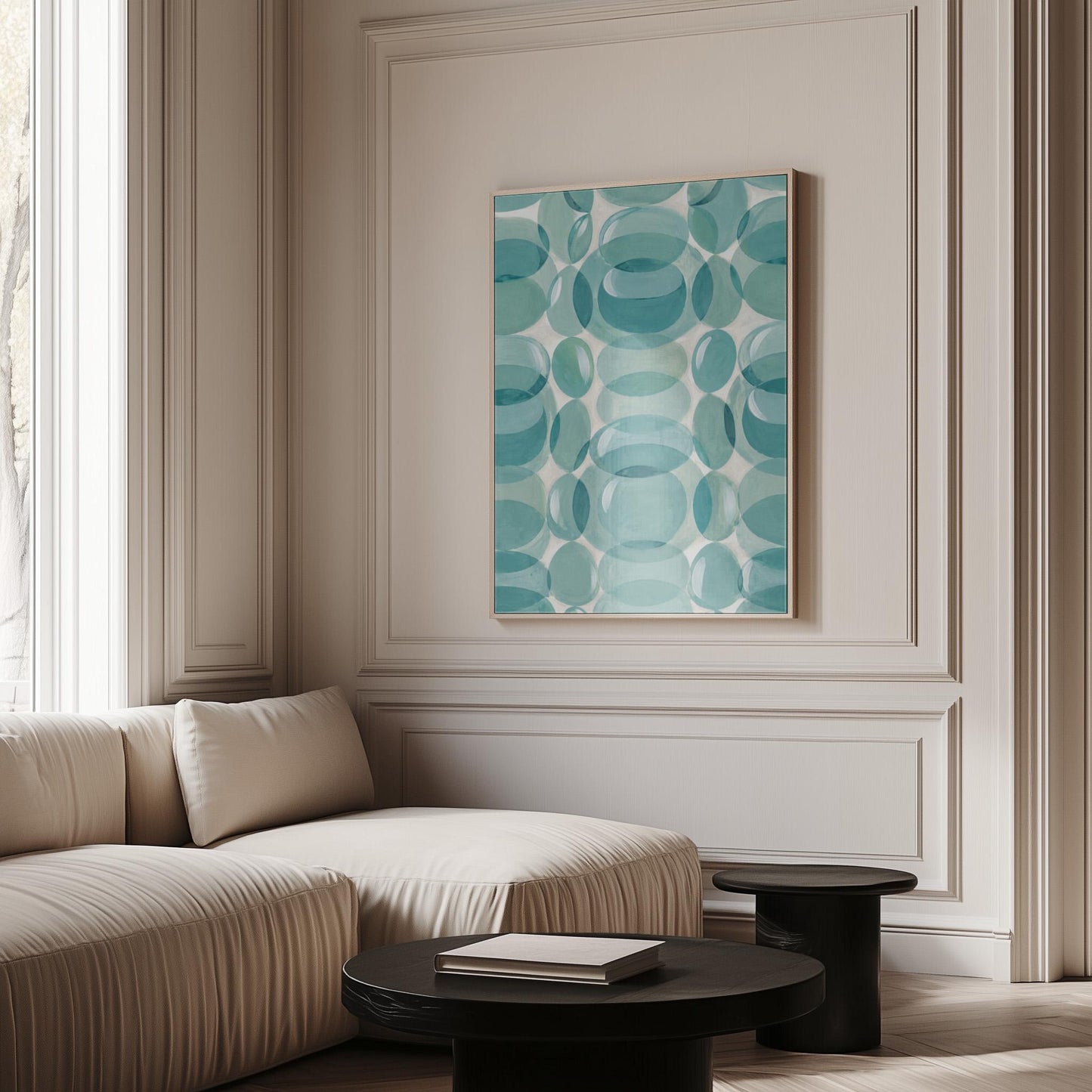 Overlapping translucent circles in teal and aqua tones, canvas wall art presented in a light, minimal room