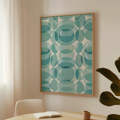 Overlapping translucent circles in teal and aqua tones, canvas wall art on a quiet wall in a considered interior