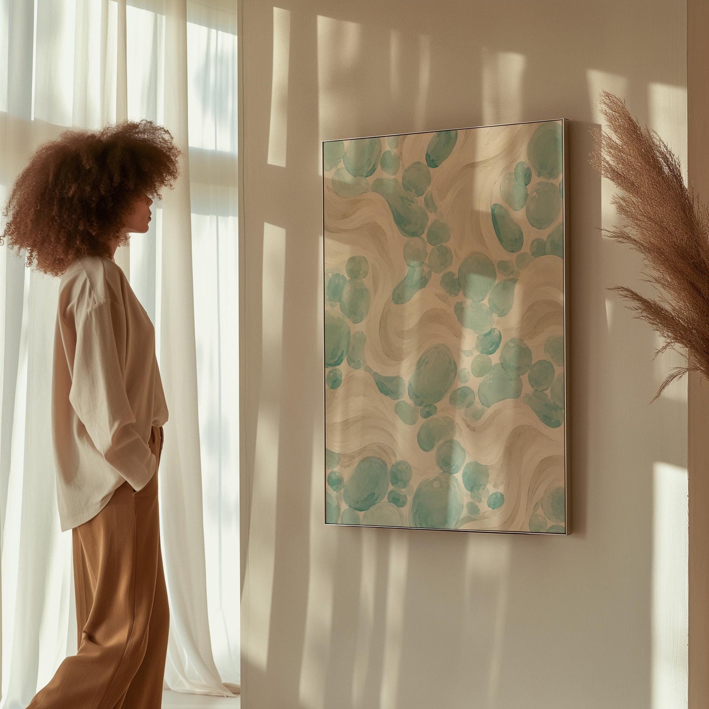 Aqua pebble shapes drifting among soft cream waves, canvas print seen in a warm interior with natural light