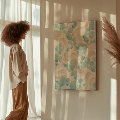 Aqua pebble shapes drifting among soft cream waves, canvas print seen in a warm interior with natural light