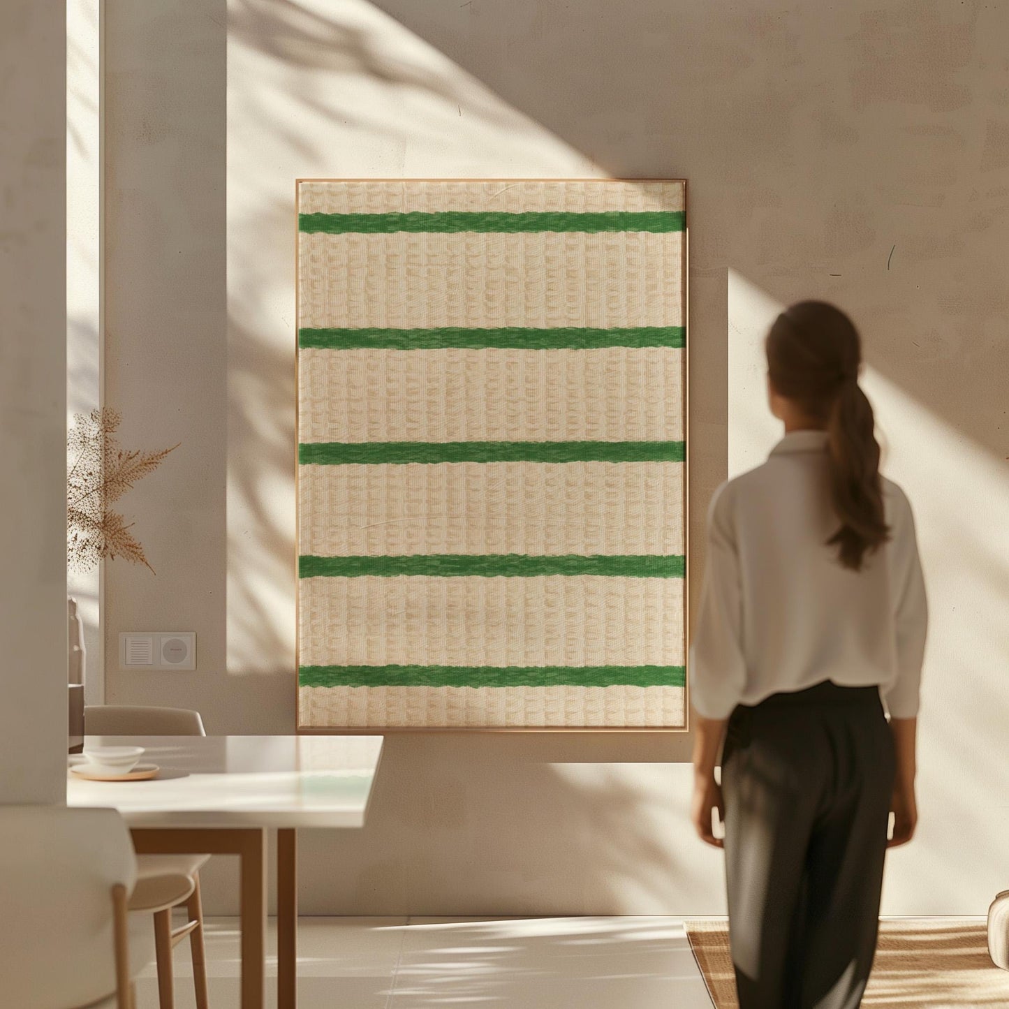 Horizontal grass green stripes on a cream background, canvas print shown in a sunlit, contemporary room