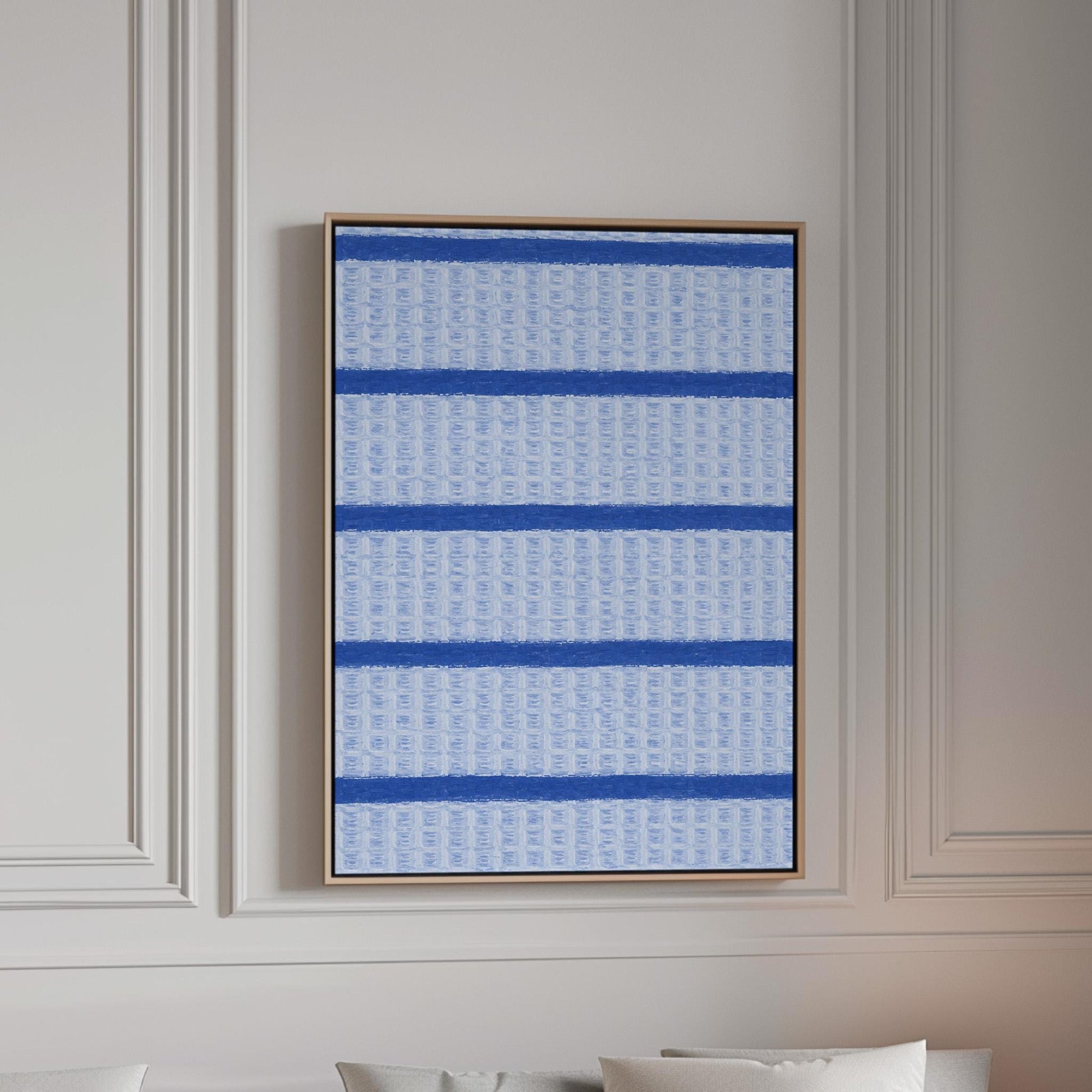 Bold cornflower blue stripes on a pale blue background, canvas print in a bright room with natural daylight