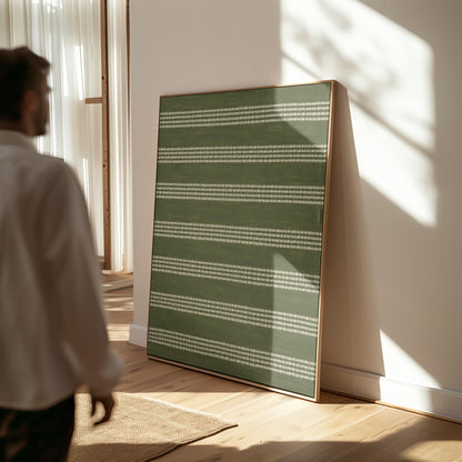 Olive green field with thin cream pinstripe rows, canvas wall art on a quiet wall in a considered interior