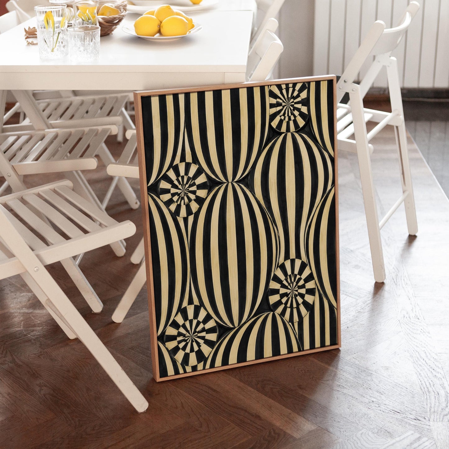 Optical illusion of striped spheres in black and cream, canvas print hanging in a calm, modern living space