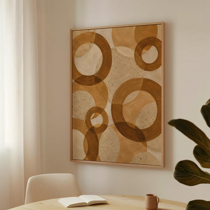 Overlapping translucent circles in amber and terracotta, canvas print styled against a soft white wall