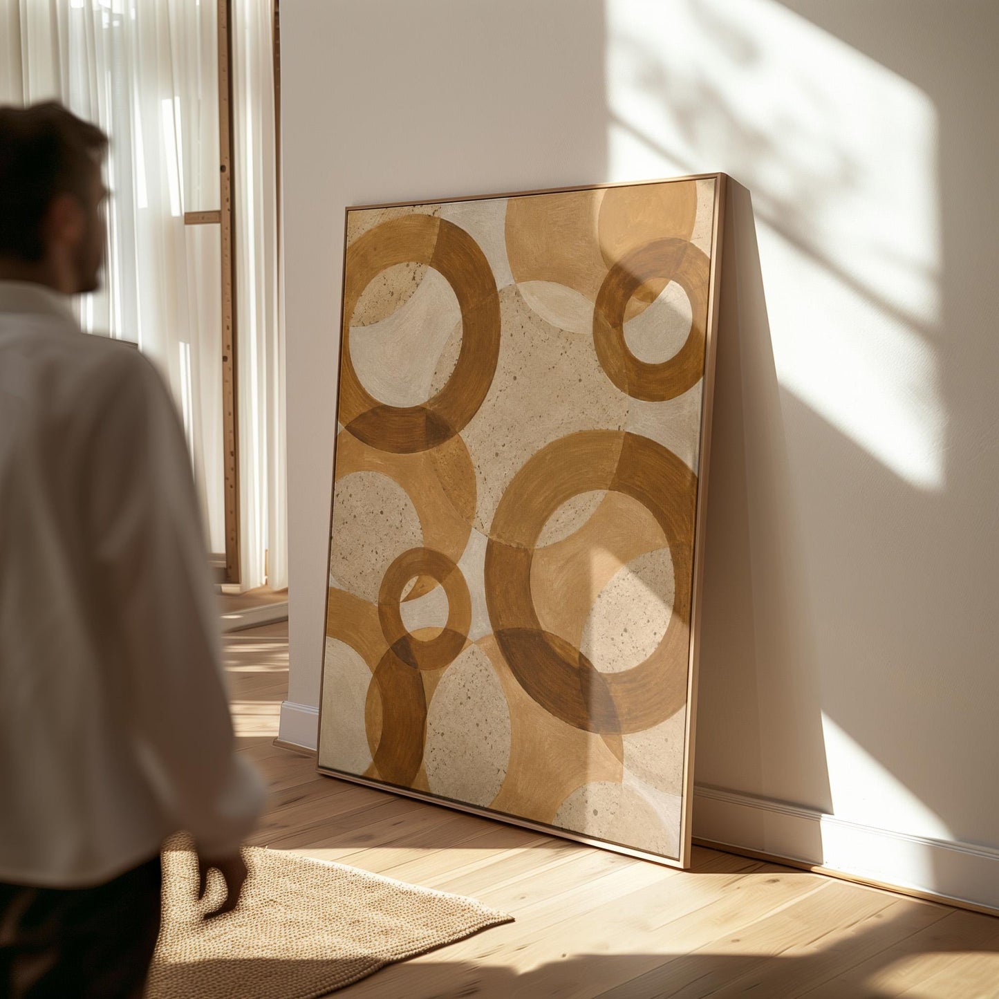 Overlapping translucent circles in amber and terracotta, canvas wall art hanging in a calm, modern living space