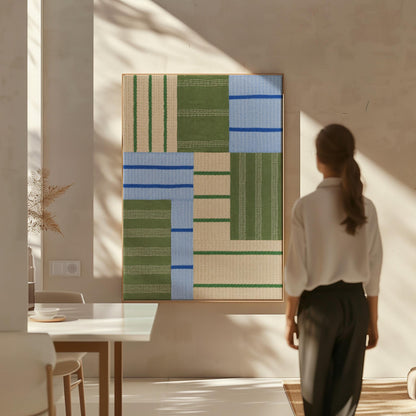 Patchwork of sage green fields with periwinkle blue bands, canvas print shown to scale in a furnished room