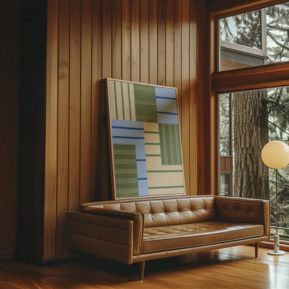 Patchwork of sage green fields with periwinkle blue bands, canvas wall art on a quiet wall in a considered interior