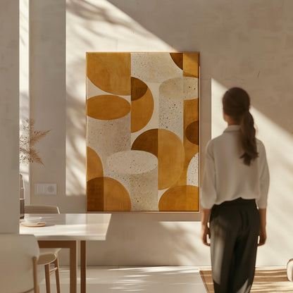 Warm caramel geometric shapes on speckled cream background, canvas print shown to scale in a furnished room