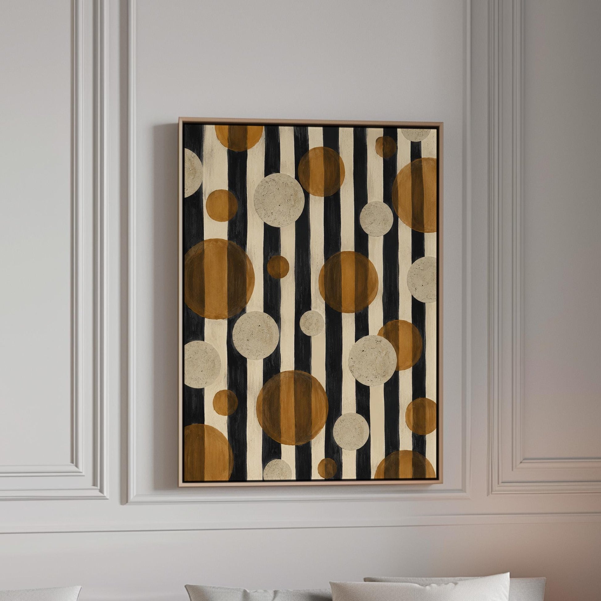 Amber and cream circles scattered over black vertical stripes, canvas print in a bright room with natural daylight