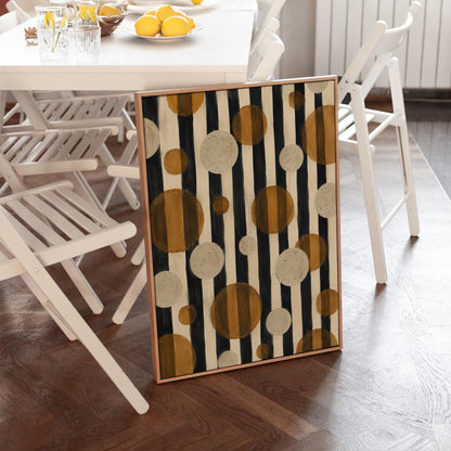 Amber and cream circles scattered over black vertical stripes, canvas print shown in a sunlit, contemporary room