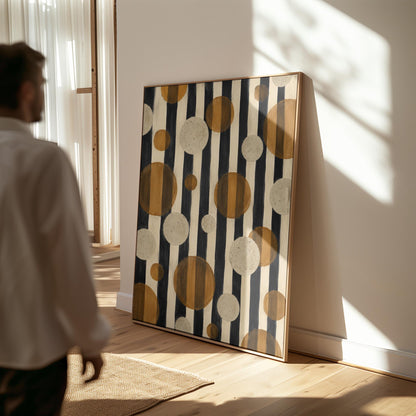 Amber and cream circles scattered over black vertical stripes, canvas wall art seen in a warm interior with natural light