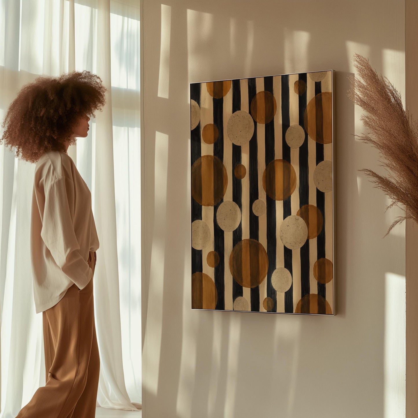 Amber and cream circles scattered over black vertical stripes, canvas wall art on a quiet wall in a considered interior