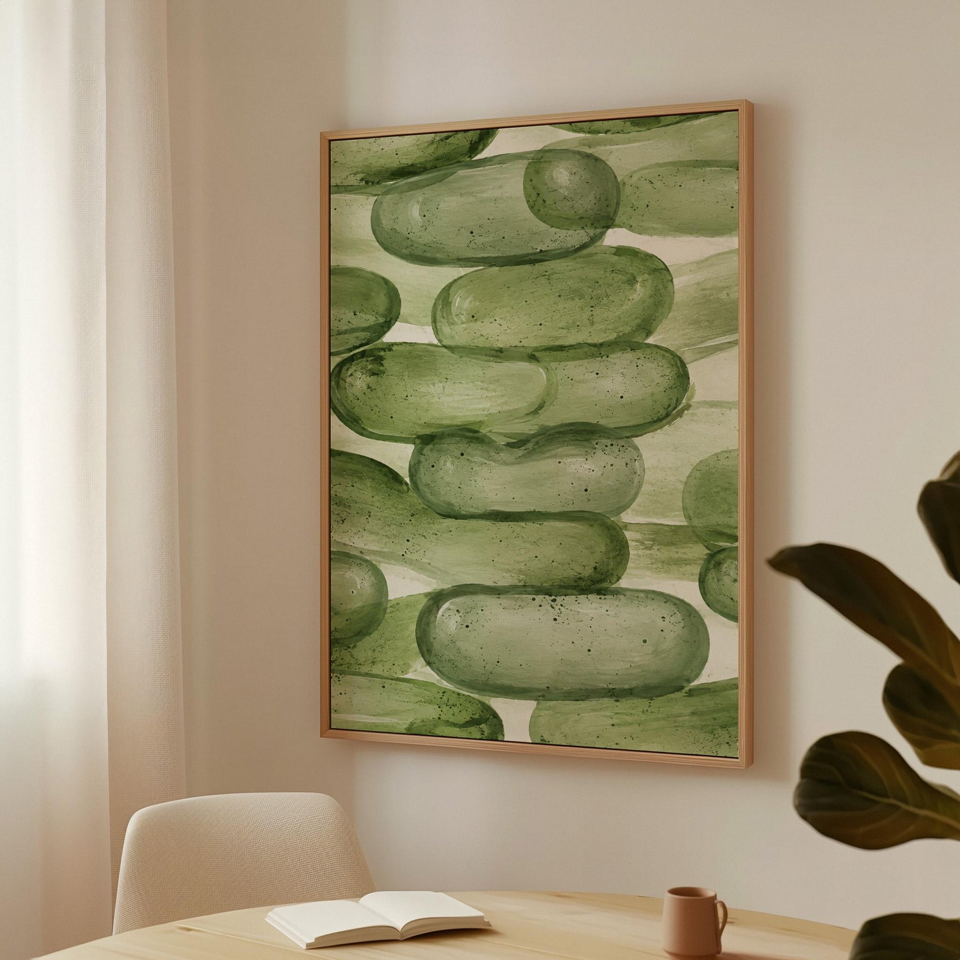 Stacked smooth green stones painted in watercolor, canvas print on a quiet wall in a considered interior