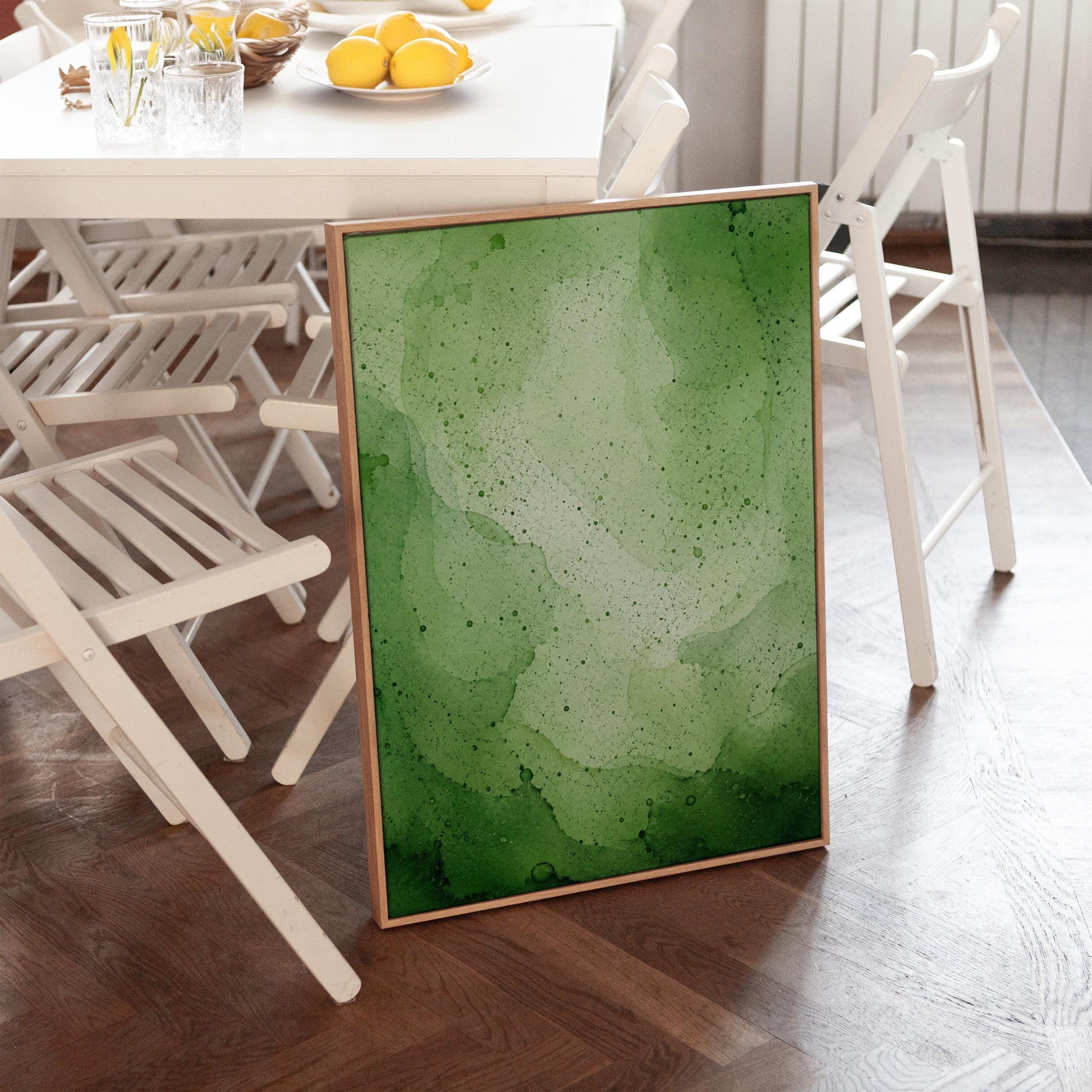 Loose watercolor wash in deep moss and forest greens, canvas print shown in a sunlit, contemporary room