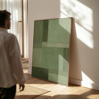 Tonal color blocks in muted sage and olive green, canvas print styled against a soft white wall