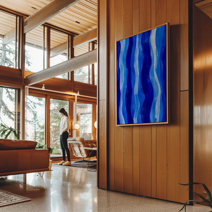 Vertical flowing ribbons in cobalt and light blue, canvas print shown in a sunlit, contemporary room