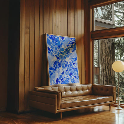 Burst of cobalt blue droplets scattering across pale background, canvas print hanging in a calm, modern living space