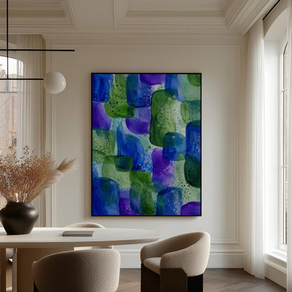 Painterly blocks in saturated blue purple and green, canvas print hanging in a calm, modern living space