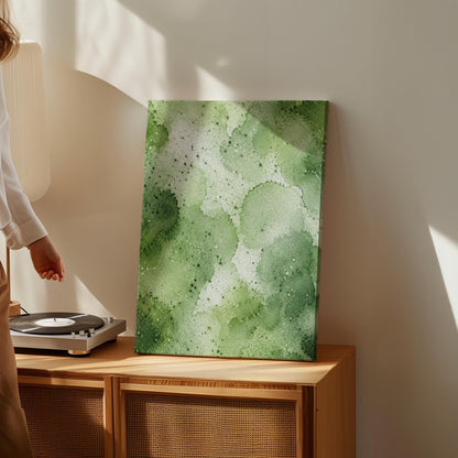 Pale speckled green watercolor wash, light and airy, canvas print styled against a soft white wall