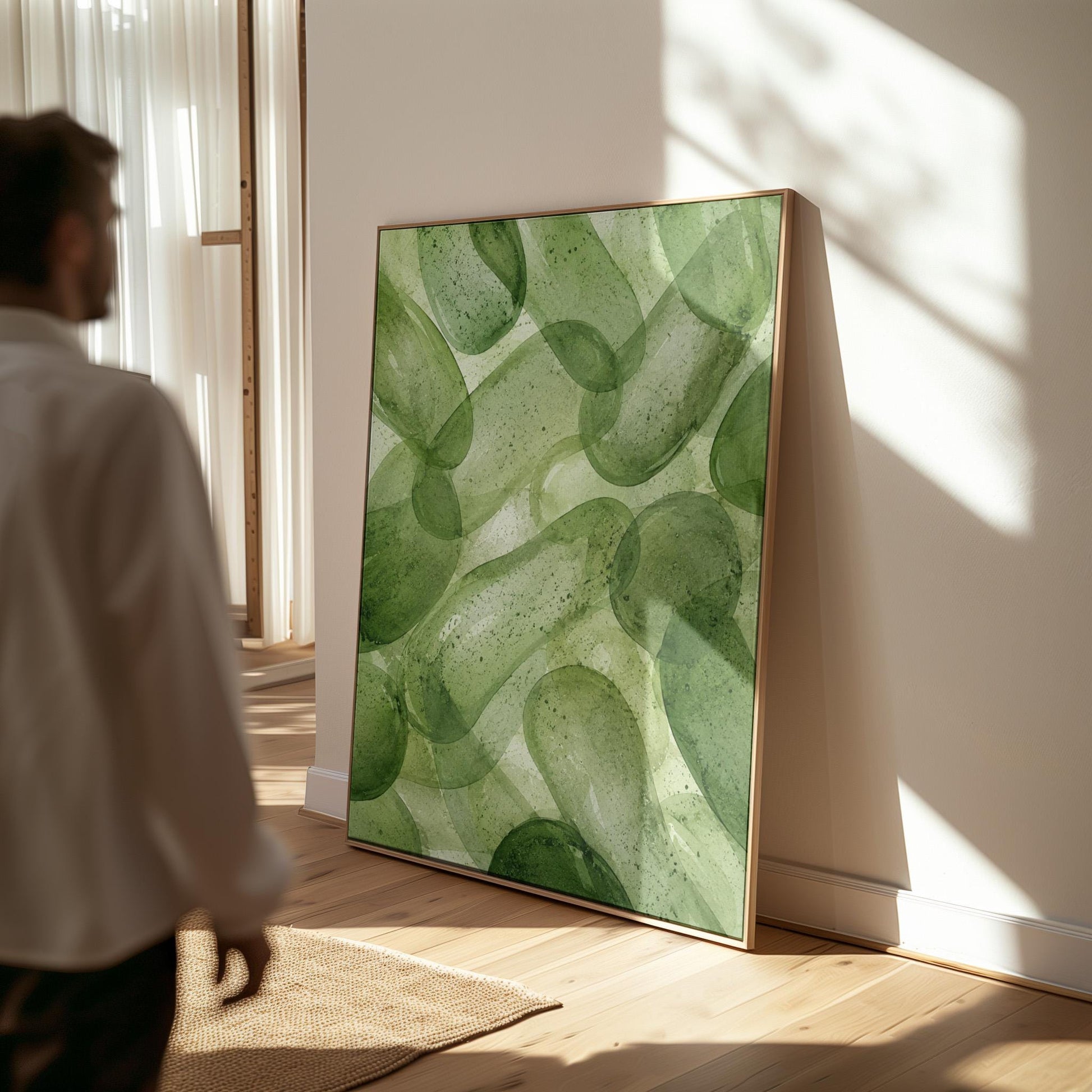 Interlaced looping rings in transparent greens, canvas wall art on a quiet wall in a considered interior