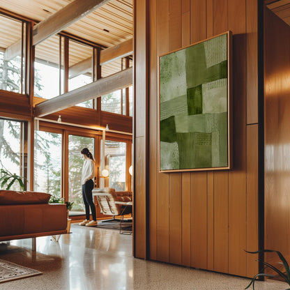 Patchwork of olive and moss green field blocks, canvas wall art hanging in a calm, modern living space