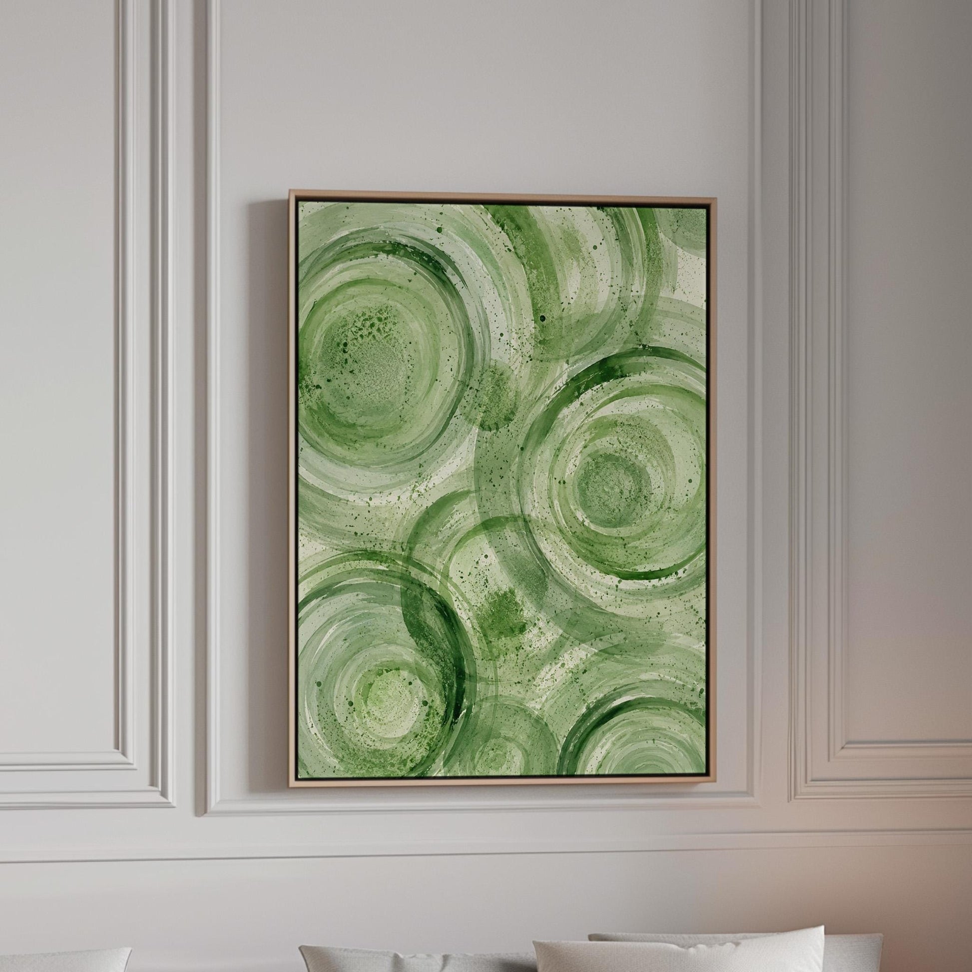 Concentric ripple rings in soft watercolor greens, canvas print in a bright room with natural daylight