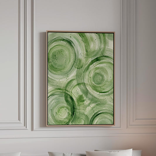 Concentric ripple rings in soft watercolor greens, canvas print in a bright room with natural daylight