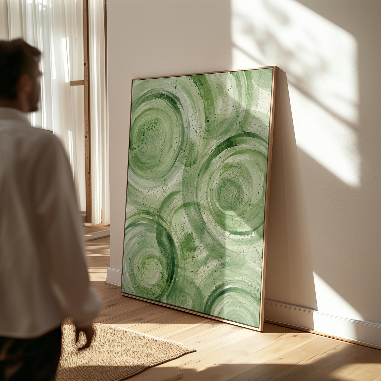 Concentric ripple rings in soft watercolor greens, canvas wall art hanging in a calm, modern living space