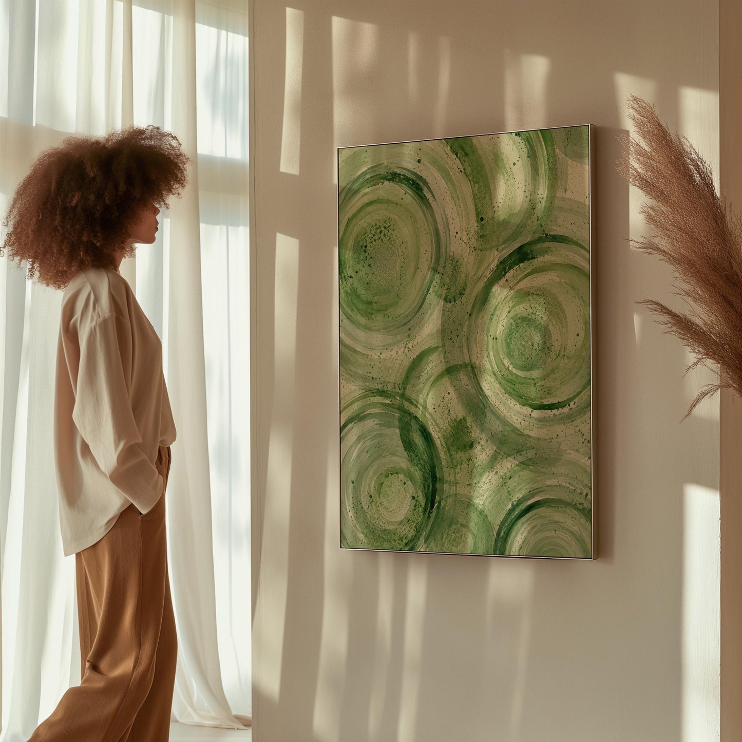 Concentric ripple rings in soft watercolor greens, canvas wall art seen in a warm interior with natural light