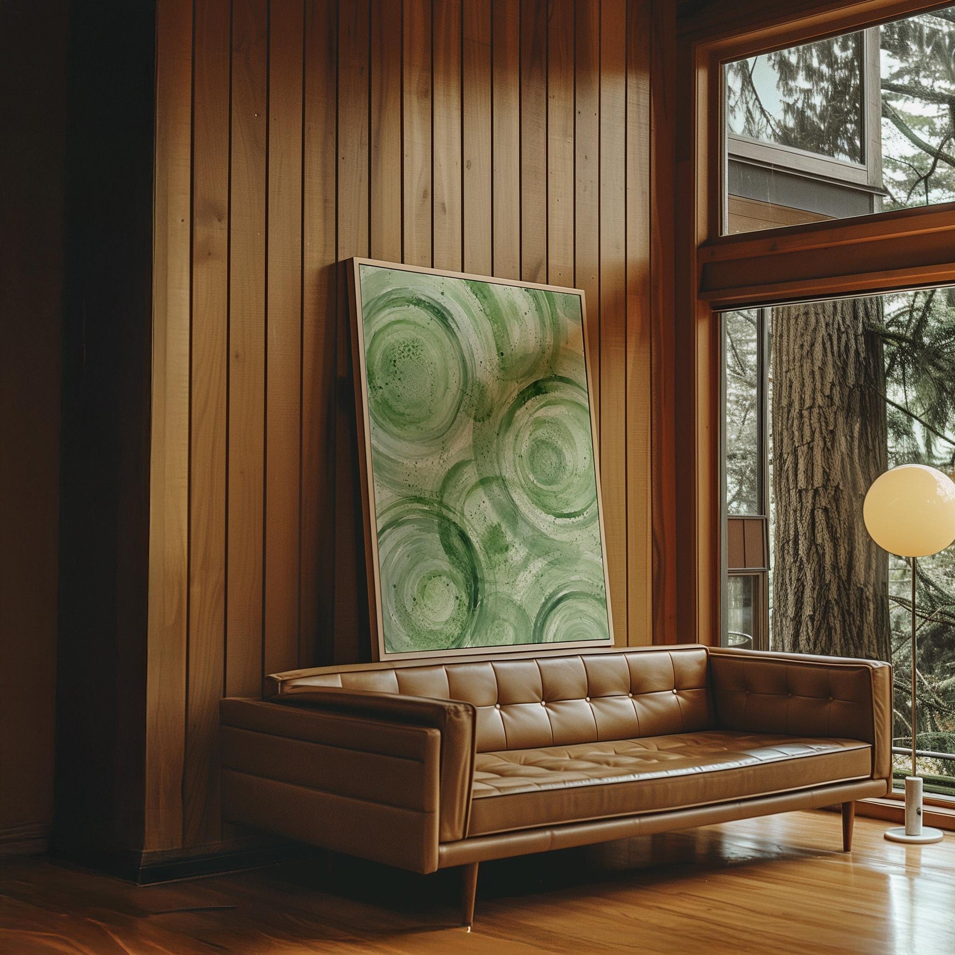 Concentric ripple rings in soft watercolor greens, canvas wall art presented in a light, minimal room