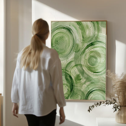 Concentric ripple rings in soft watercolor greens, canvas wall art on a quiet wall in a considered interior