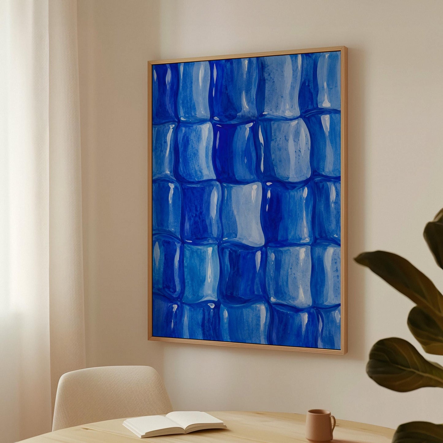 Grid of rounded squares in layered cobalt blues, canvas print shown in a sunlit, contemporary room