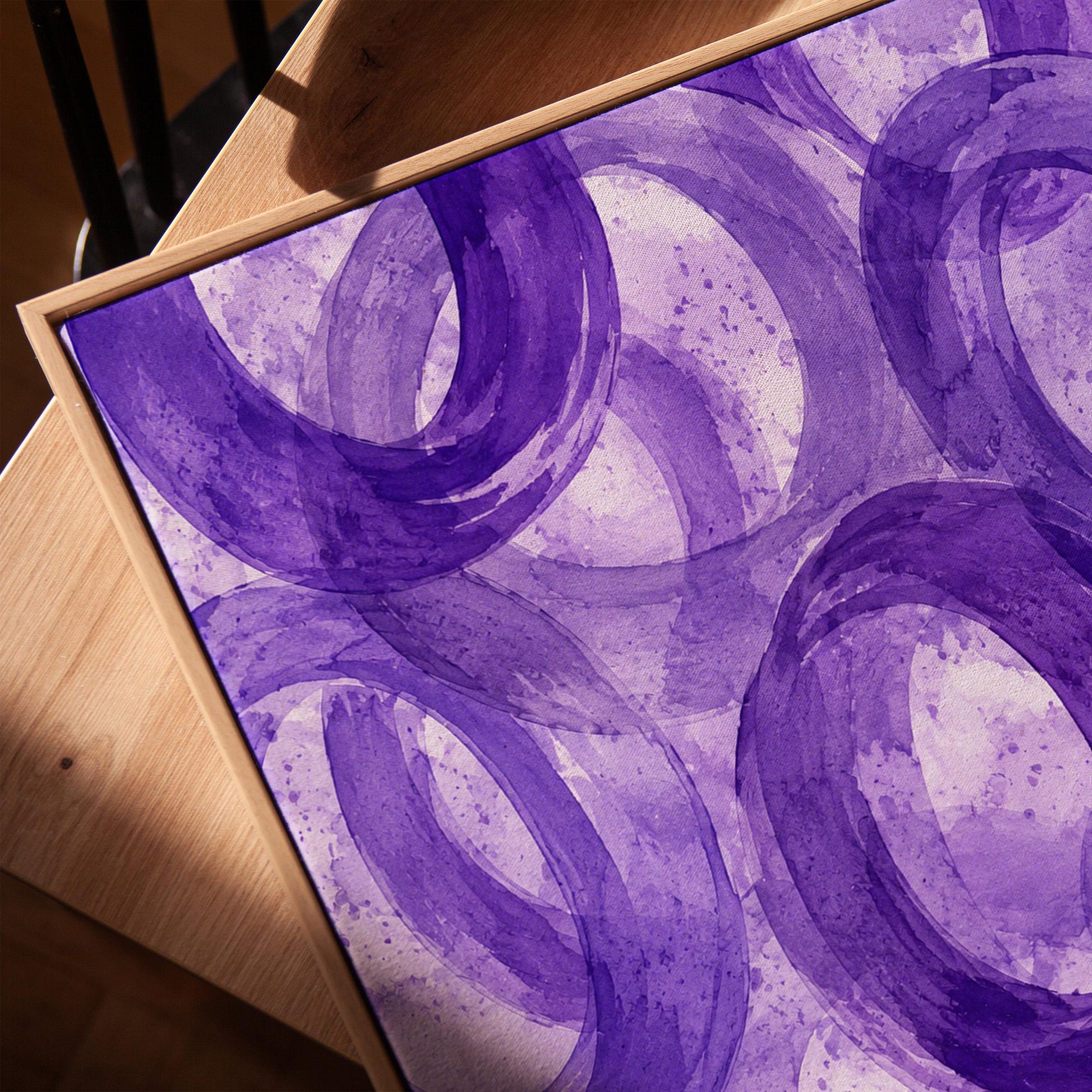 Swirling amethyst purple rings on pale background, canvas print in a warm, minimally styled interior