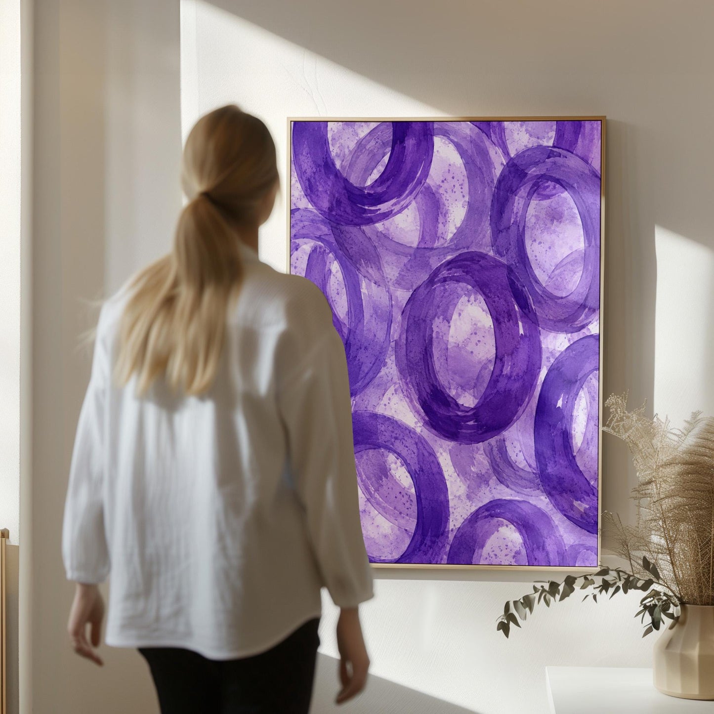 Swirling amethyst purple rings on pale background, canvas wall art styled against a soft white wall