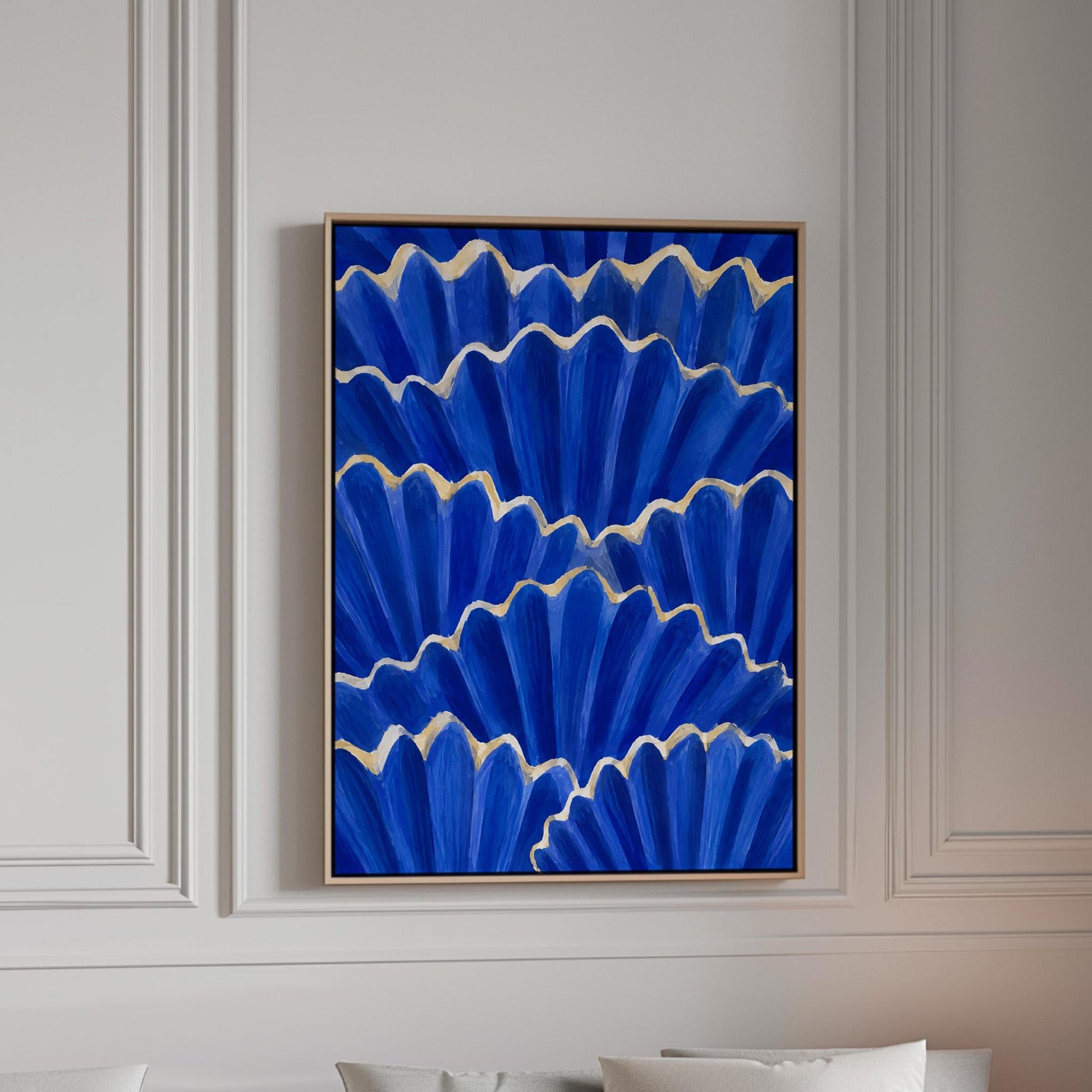 Fan shaped scallop shells in cobalt with gold edges, canvas print in a bright room with natural daylight