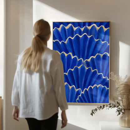 Fan shaped scallop shells in cobalt with gold edges, canvas print on a quiet wall in a considered interior