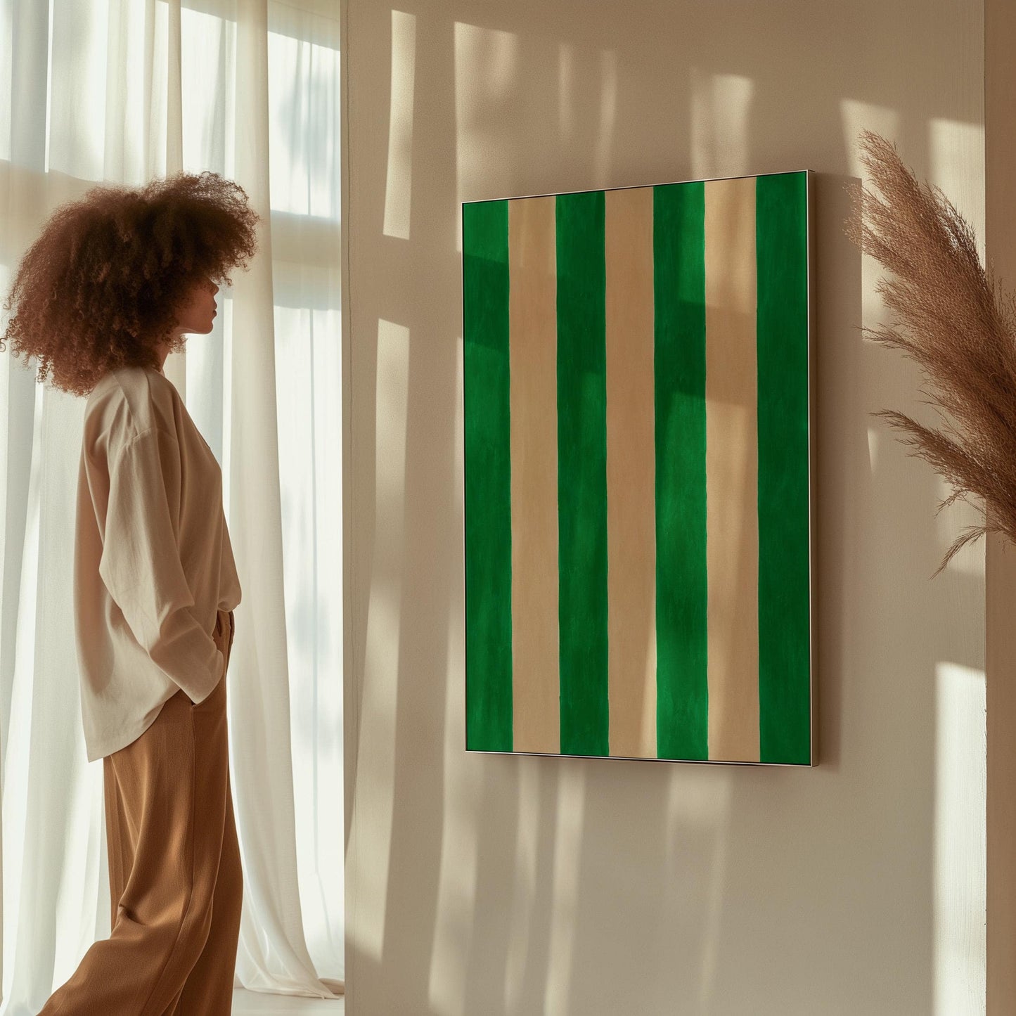 Bold vertical cabana stripes in emerald green and cream, canvas print styled against a soft white wall