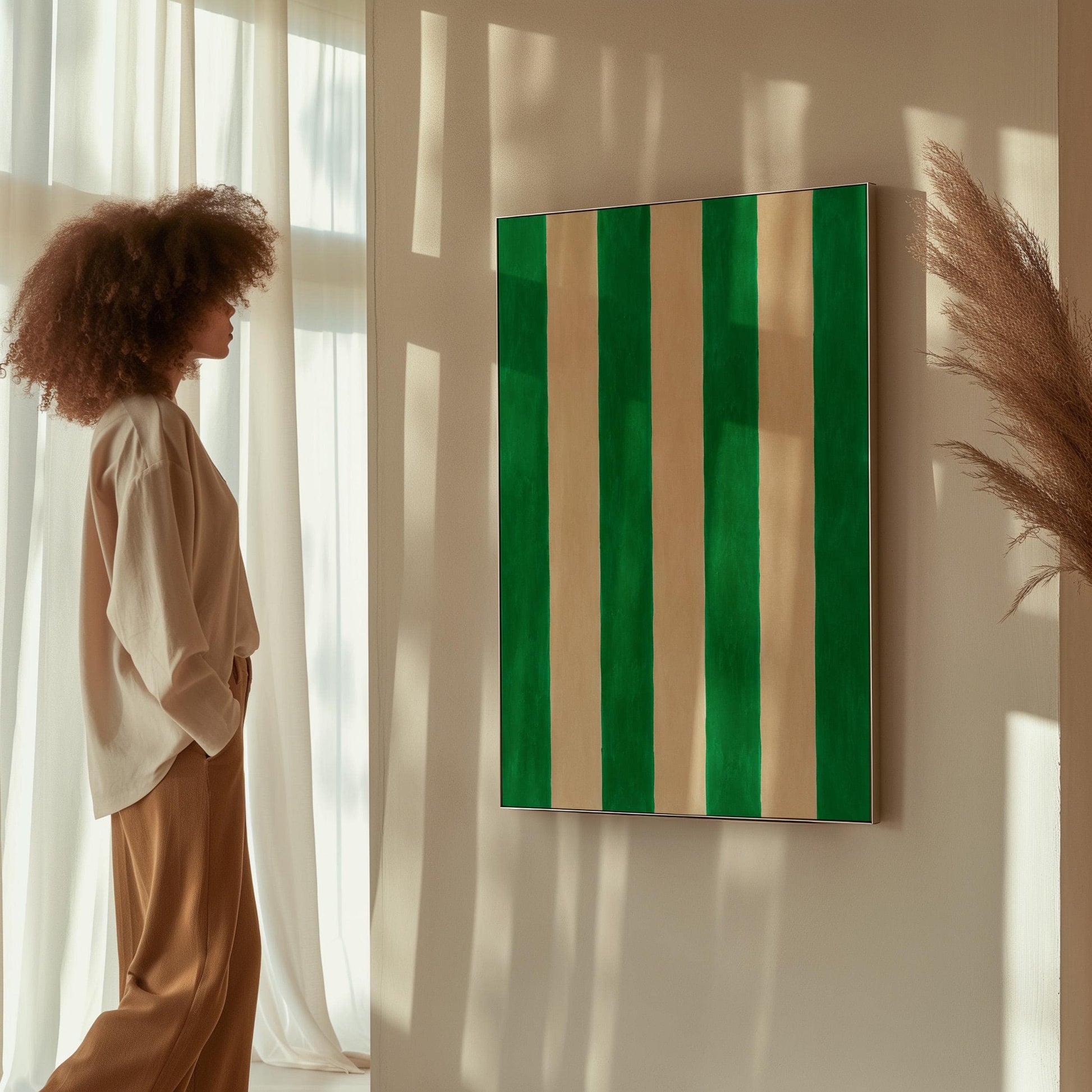 Bold vertical cabana stripes in emerald green and cream, canvas print styled against a soft white wall