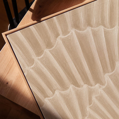 Overlapping fan shells in warm sand and taupe, canvas print in a warm, minimally styled interior
