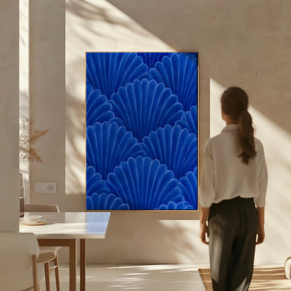 Fan shaped shell scales pattern in sapphire blue, canvas wall art on a quiet wall in a considered interior